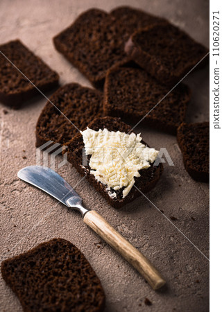 Dark rue bread on brown background Dark rue bread on brown background 110620271