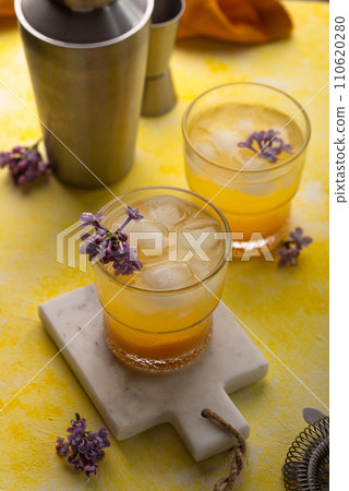 Summer cocktail with mango juice and ice 110620280