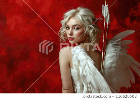 Beautiful blond woman in a cupid costume with arrow on red studio background Beautiful blond woman in a cupid costume with arrow on red studio background 110620508