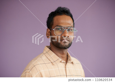 Portrait of serious confident software developer in glasses looking at camera Portrait of serious confident software developer in glasses looking at camera 110620534