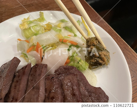 Grilled beef tongue, pickled Chinese cabbage, and Nanban miso Grilled beef tongue, pickled Chinese cabbage, and Nanban miso 110622721