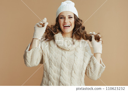 happy elegant woman showing hair isolated on beige happy elegant woman showing hair isolated on beige 110623232