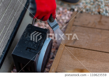 A man laying gravel, gardening, gardening 110623559
