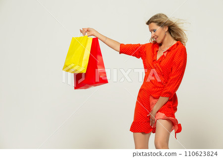 Beautiful grey-haired 50s woman looking at camera isolated on white.  110623824