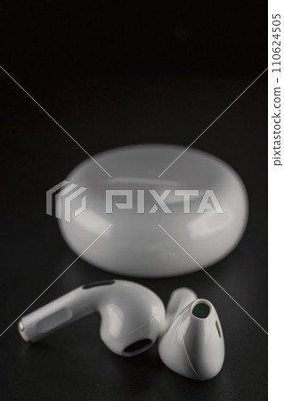 ROSTOV-ON-DON, RUSSIA - APRIL 28, 2018: Apple AirPods wireless Bluetooth headphones and charging case for Apple iPhone. New Apple Earpods Airpods in box. 110624505