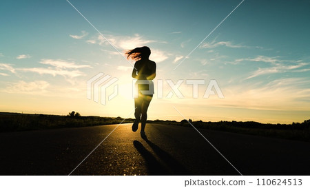 silhouette sports girl running along road sunset, woman running treadmill. healthy woman running treadmill, stretching body, american woman running along road, young arabic female athlete, exercise 110624513