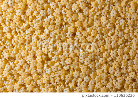 Uncooked Stelline Pasta Background Uncooked Stelline Pasta Background 110626226
