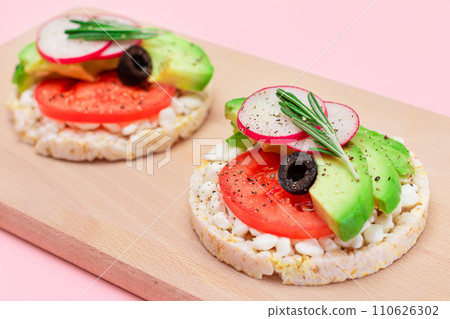 Rice Cake Sandwiches with Avocado, Tomato, Cottage Cheese, Olives and Radish Rice Cake Sandwiches with Avocado, Tomato, Cottage Cheese, Olives and Radish 110626302