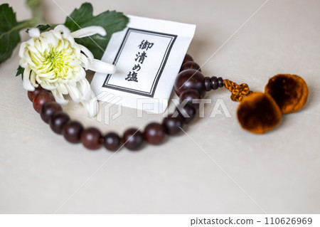 Prayer beads and white chrysanthemums (funeral image) Prayer beads and white chrysanthemums (funeral image) 110626969