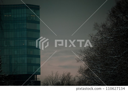 Glass building with evening sky background. Modern office building detail, glass surface 110627134