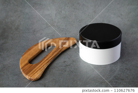 face massager guasha and skin care lotion 110627676