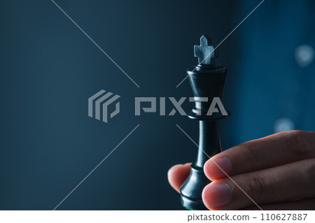 businessman hand holding black king of chess board ,team leader, leadership and business strategy concept businessman hand holding black king of chess board ,team leader, leadership and business strategy concept 110627887