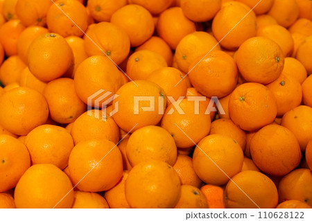Background from yellow oranges. Tropical fruits. 110628122