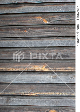 Classic background of wooden planks of uneven gray color. 110628130