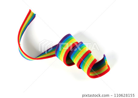Colorful rainbow ribbon closeup isolated on white background. Colorful LGBT design. Curly, fluttering ribbon. 110628155