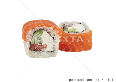 Sushi closeup isolated on white background. Sushi roll baked with red fish, trout, Philadelphia cheese and cucumber and tuna. Japanese restaurant menu. Sushi closeup isolated on white background. Sushi roll baked with red fish, trout, Philadelphia cheese and cucumber and tuna. Japanese restaurant menu. 110628191
