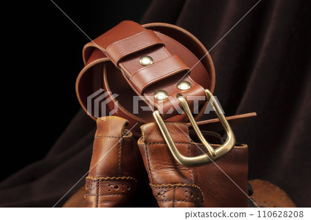 Part of a brown belt made of genuine expensive leather. 110628208