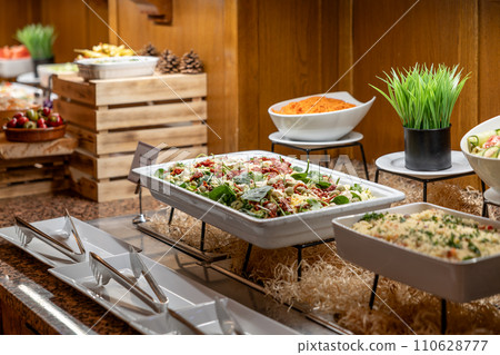 Catering meals prepared for guests at a wedding or hotel dinner. Healthy salads and other vegetables 110628777
