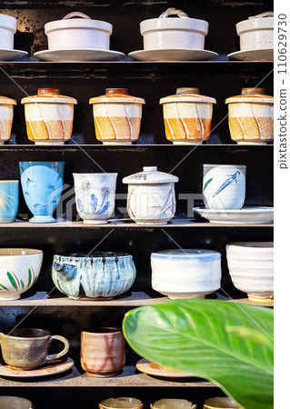 Handmade ceramic pottery on display. 110629730
