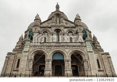 The main entrance of the Roman Catholic church Sacre Coeur Basilica in Montmartre. The main entrance of the Roman Catholic church Sacre Coeur Basilica in Montmartre. 110629920