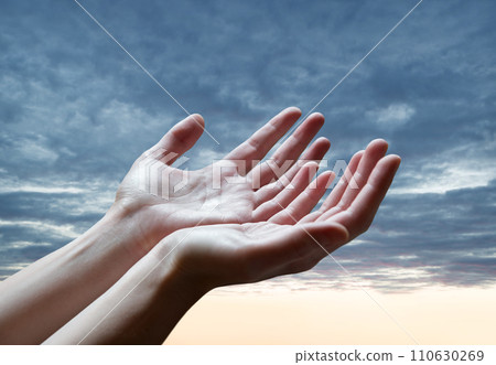 The outstretched hands of a praying man The outstretched hands of a praying man 110630269