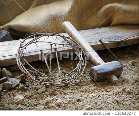 Rusty nails and a wreath of thorns at the cross 110630277