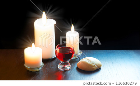 A bowl of wine and bread on the table. Communion symbols A bowl of wine and bread on the table. Communion symbols 110630279