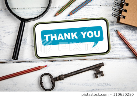 THANK YOU Concept. Mobile phone on white office table 110630280