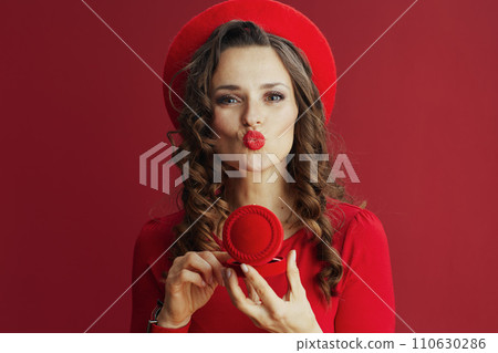woman in dress and beret isolated on background sending kiss woman in dress and beret isolated on background sending kiss 110630286
