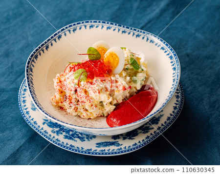 Mayonnaise salad with crab meat, decorated with beetroot mousse in restaurant-style plating. Imitation crab salad with crab sticks or crab meat and eggs in bowl on blue background Mayonnaise salad with crab meat, decorated with beetroot mousse in restaurant-style plating. Imitation crab salad with crab sticks or crab meat and eggs in bowl on blue background 110630345