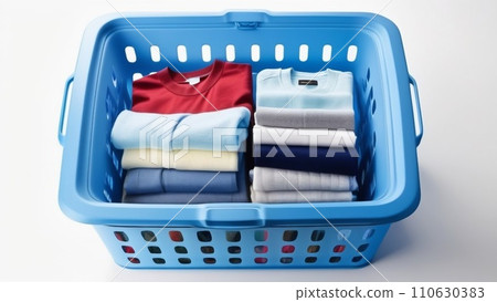 Colorful clothes in a laundry basket on white background. Blue, indigo, purple. Colorful clothes in a laundry basket on white background. Blue, indigo, purple. 110630383