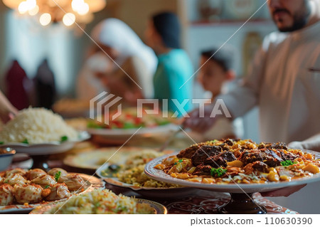 Closeup of al-fitr meals, on background arabian people at home Closeup of al-fitr meals, on background arabian people at home 110630390