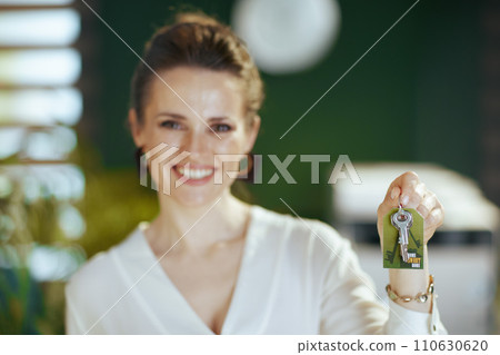Smiling female realtor in green office 110630620