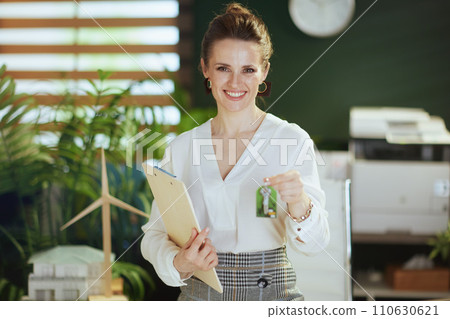 happy modern woman realtor in modern green office happy modern woman realtor in modern green office 110630621