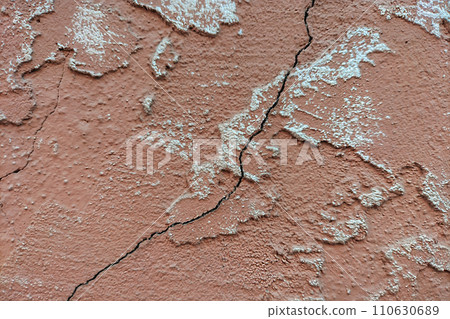 Burgundy wall with vertically diagonal crack and irregularities. Blank for artwork, background, screensaver and wallpaper Burgundy wall with vertically diagonal crack and irregularities. Blank for artwork, background, screensaver and wallpaper 110630689