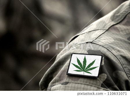 Cannabis leaf on military uniform. Flag with marijuana leaf. Cannabis legalization. Cannabis in Armed Forces. Cannabis leaf on military uniform. Flag with marijuana leaf. Cannabis legalization. Cannabis in Armed Forces. 110631071