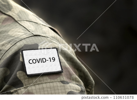 COVID-19 sign on military uniform. COVID-19 concept. Coronavirus war concept. World pandemic. 110631078