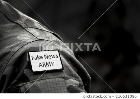 Fake News. Inscription Fake News Army on military uniform. Fake News Concept. Digital War. Fake News. Inscription Fake News Army on military uniform. Fake News Concept. Digital War. 110631086