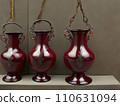 3 pcs Antique ruby-red carved vase with handles and chain for hanging. Generative AI 110631094