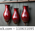 3 Piece Antique ruby-red carved vase with handles hanging on a wooden shelf. Generative AI 110631095