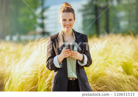 happy modern business woman in business district happy modern business woman in business district 110631515