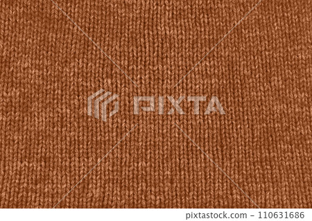 Background textile fabric with knitted wool texture in peach color. Background textile fabric with knitted wool texture in peach color. 110631686
