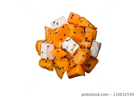 Delicious juicy salad of diced grilled pumpkin with feta cheese, spices and sesame seeds 110632559