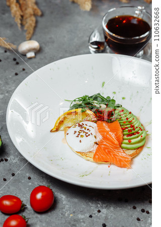 Summer healthy fastfood lunch, breakfast with Pancake with red fish, avocado and egg for breakfast. Aesthetic still life, healthy food concept 110632668