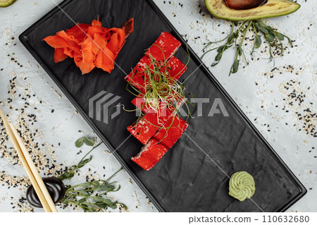 Traditional delicious fresh sushi roll set. Sushi roll with rice, nori, cream cheese, tobiko caviar, avocado. Sushi menu. 110632680