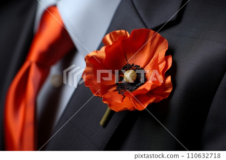 Poppy flower in the buttonhole of a man's jacket, a remembrance poppy in memory of fallen soldiers in the war 110632718