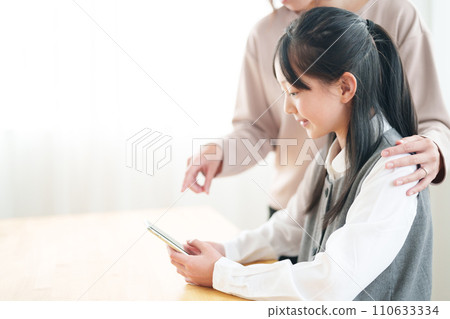 Girls using smartphones 110633334