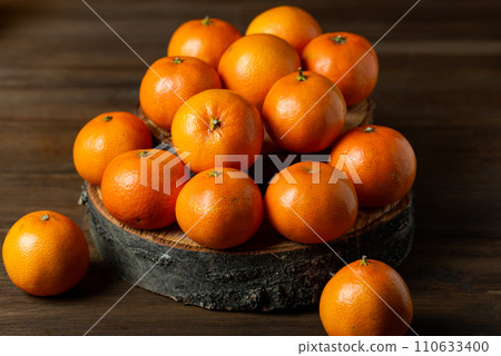 dried dates fruits on the wood board on a table. dried dates fruits on the wood board on a table. 110633400