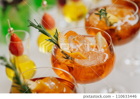 Welcome drink with cocktail glasses and drinks at an event. Alcoholic beverages at a wedding Welcome drink with cocktail glasses and drinks at an event. Alcoholic beverages at a wedding 110633446
