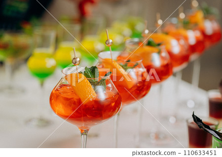 Welcome drink with cocktail glasses and drinks at an event. Alcoholic beverages at a wedding 110633451